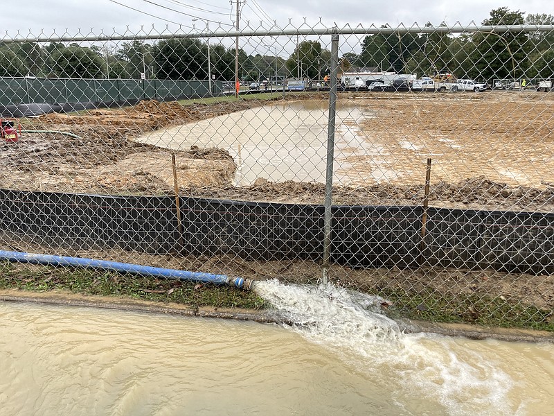 Construction crews broke a water main on Monday morning at the building site of a new Arkansas Children's Hospital clinic near JRMC. The line was repaired within a couple of hours but not before causing some minor flooding in the area around the work site. (Pine Bluff Commercial/Byron Tate)