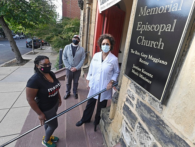 Rev. Grey Maggiano (center), rector of Memorial Episcopal Church in Baltimore, stands with Shannon McCullough (left) and Dr. Carol Scott. McCullough, Scott and Karen Mercer (not pictured) created Kindred Coaches, to train people to be peer counselors to help others manage their own health and to reduce disparities in health care in disadvantaged neighborhoods.
(The Baltimore Sun/TNS/Kenneth K. Lam)