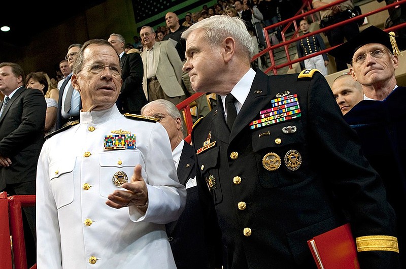 Retired Gen. J.H. Binford Peay III, right, attends an event at U.S. Central Command. He resigned Monday as superintendent of the Virginia Military Institute. MUST CREDIT: U.S. Central Command.
