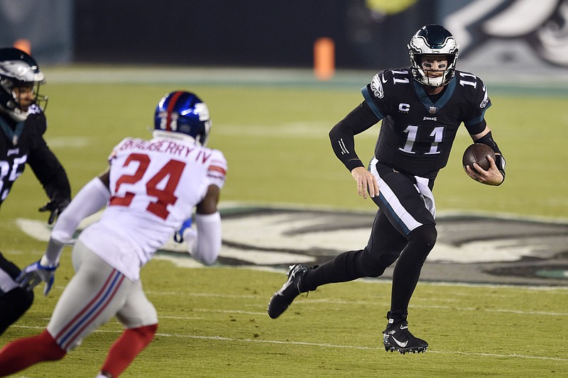 Philadelphia Eagles' Carson Wentz scrambles during the first half of an NFL football game against the New York Giants, Thursday, Oct. 22, 2020, in Philadelphia. (AP Photo/Derik Hamilton)