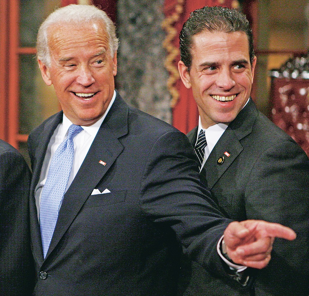 Vice President-elect Joe Biden stands with son Hunter during a re-enactment of the Senate oath ceremony Jan. 6, 2009, in the Old Senate Chamber on Capitol Hill in Washington.
(File Photo/AP/Charles Dharapak)