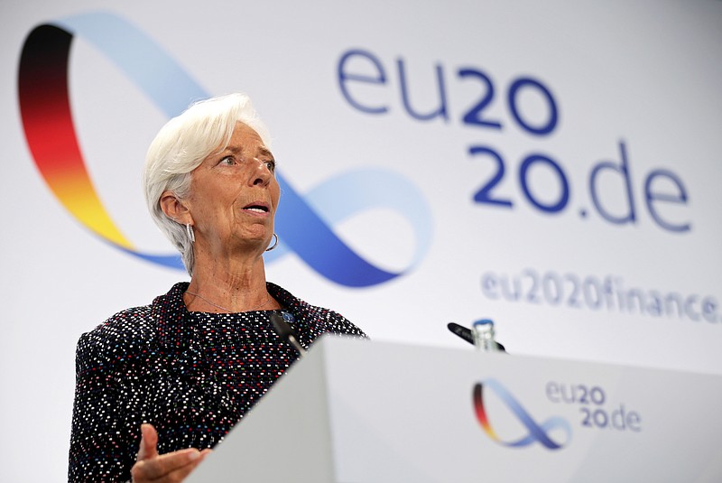 FILE - In this Sept. 11, 2020 file photo, European Central Bank (ECB) President Christine Lagarde attends a news conference during the Informal Meeting of Economics and Finance Ministers in Berlin, Germany.   The European Central Bank held off from strengthening its stimulus programs despite growing concern that a renewed surge in COVID-19 cases could stall the economy’s recovery from the deep downturn early this year.  The bank on Thursday, Oct. 29,  made no change to its 1.35 trillion ($1.58 trillion) pandemic emergency bond purchase program, which pumps newly created money into the economy to keep credit flowing to businesses and promote economic activity.   Hannibal Hanschke/Pool Photo via AP, File)