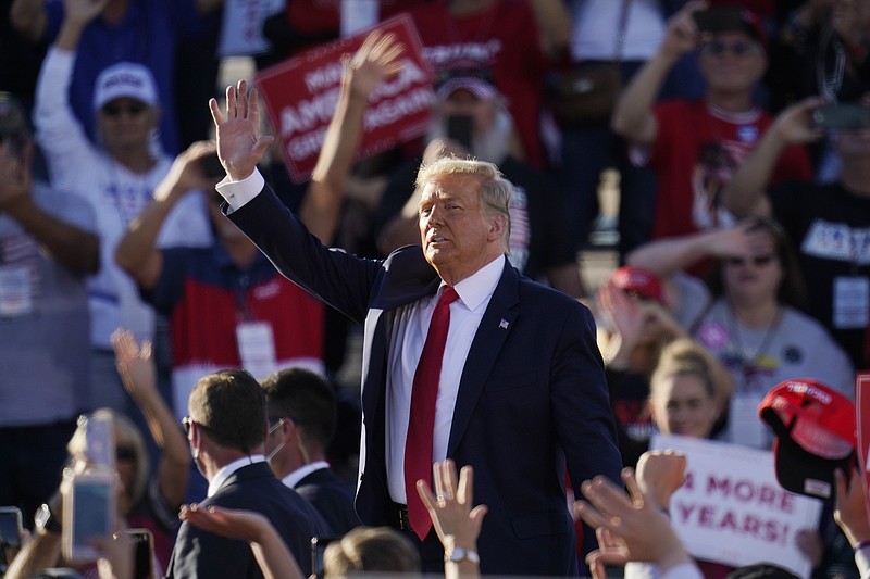 President Donald Trump waves to the crowd after speaking at a campaign rally at Phoenix Goodyear Airport Wednesday, Oct. 28, 2020, in Goodyear, Ariz. (AP Photo/Ross D. Franklin)