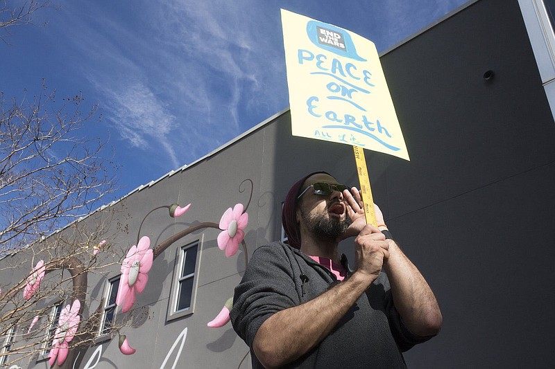 An Attendee cheers, Saturday, January 25, 2020 at a rally for peace at the square in Fayetteville. Check out nwaonline.com/200126Daily/ for today’s photo gallery.
(NWA Democrat-Gazette/Charlie Kaijo)

The OMNI Center and Arkansas Nonviolence Alliance held a protest march and rally for peace, calling for a stop to war with Iran and endless wars everywhere.

The rally featured several musicians and speakers, including OMNI Founder Dr. Dick Bennett, Afghanistan war veteran Nathan Hudson, University of Arkansas students, and other leaders and activists.

This event was part of an International Day of Protest organized and endorsed by dozens of national organizations for justice and peace.