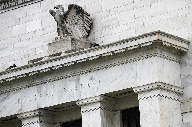 FILE - This May 22, 2020, file photo shows the Federal Reserve building in Washington. A Federal Reserve survey of business conditions around the country has found that the U.S. economy grew at a “slight to modest” pace in September 2020 and early October. (AP Photo/Patrick Semansky, File)