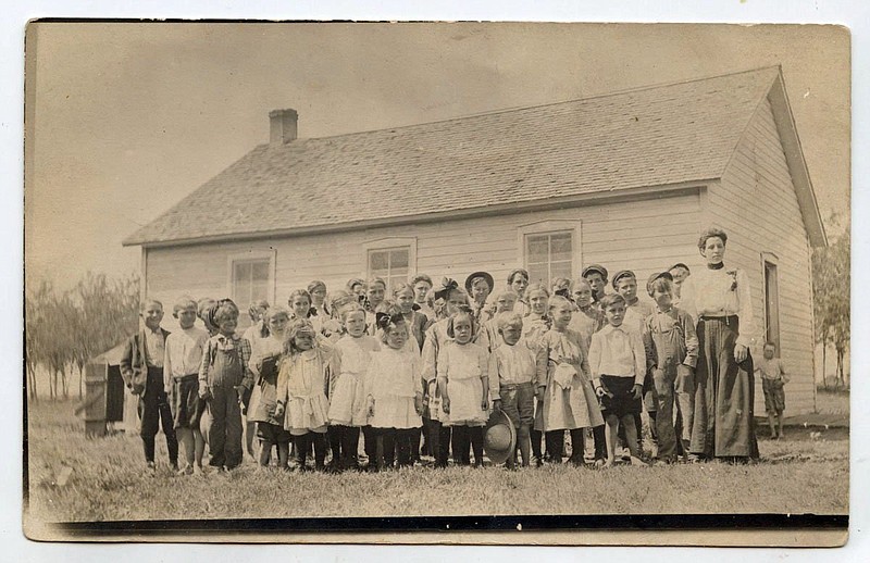 Tichnor, circa 1910: "Aunt Ollie school group in Tichnor school house." It seems likely teacher Aunt Ollie had emptied the Arkansas County town's entire one-room school onto the lawn. What looks like an outhouse is on the left. At the time Arkansas had 9,500 teachers and more than 5,000 independent school districts with a school year averaging 107 days.
Arkansas Postcard Past, P.O. Box 2221, Little Rock, AR 72203 story.lead_photo.caption
