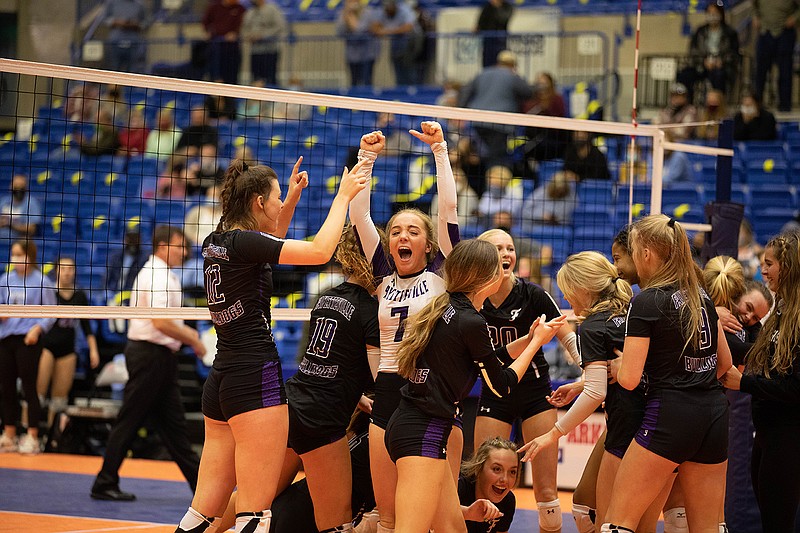 Fayetteville libero Kennedy Phelan (7) and the rest of her team celebrate their 3-1 victory over Forth Smith Southside Saturday in the Class 6A state volleyball final at Bank OZK Arena. - Photo by Justin Cunningham of Arkansas Democrat-Gazette