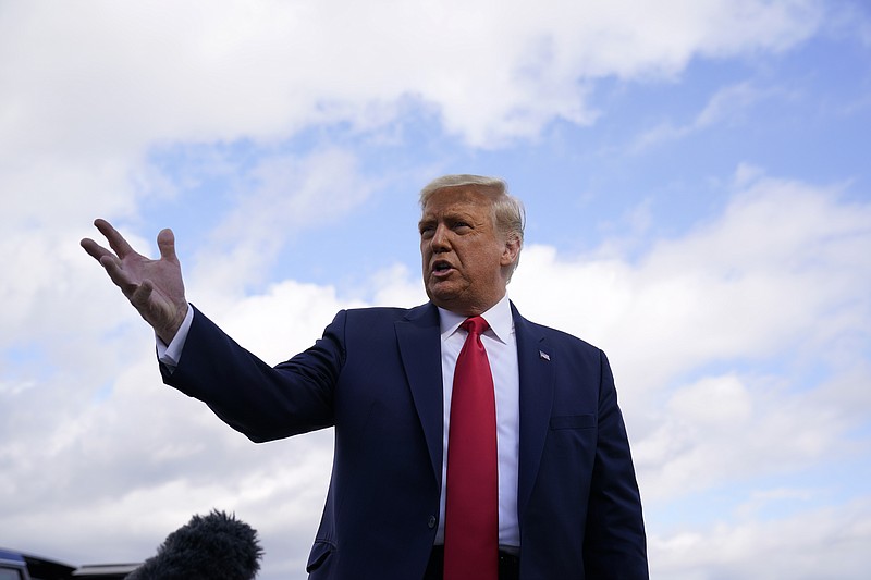 President Donald Trump speaks before boarding Air Force One upon departure Saturday, Oct. 31, 2020, at Andrews Air Force Base, Md., as he departs for campaign rallies in Pennsylvania. (AP Photo/Alex Brandon)