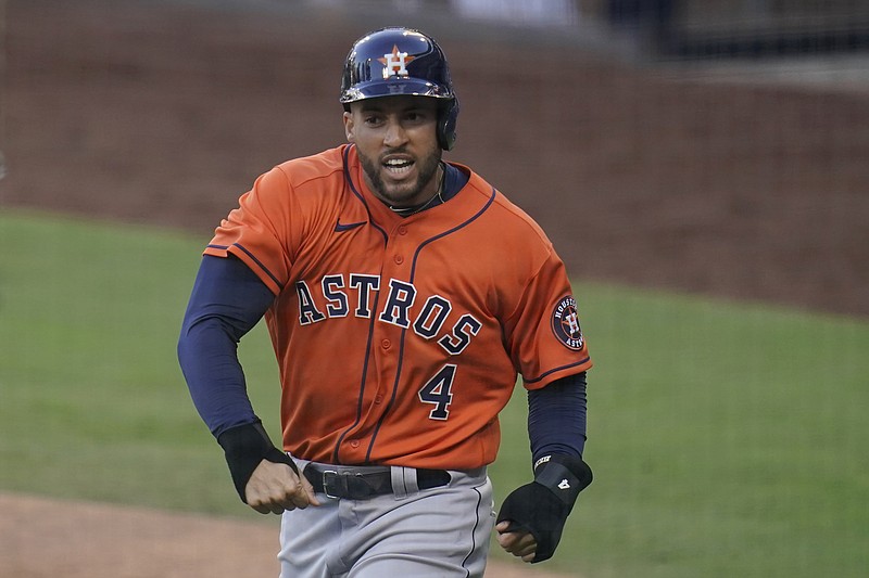 Houston Astros George Springer reacts after scoring on a single by Jose Altuve against the Tampa Bay Rays during the fifth inning in Game 6 of a baseball American League Championship Series, Friday, Oct. 16, 2020, in San Diego. (AP Photo/Gregory Bull)