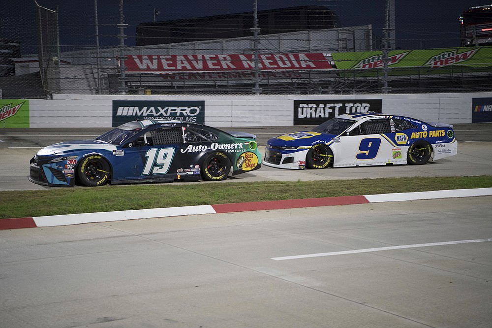 Martin Truex Jr. (19) could not hold the leaders Chase Elliott (9) would go on to wn during a NASCAR Cup Series auto race at the Martinsville Speedway in Martinsville, Va., Sunday, Nov.1, 2020. (AP Photo/Lee Luther Jr.)