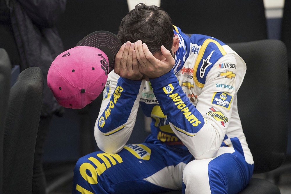 Chase Elliott (9) gathers himself while in the media room after winning a NASCAR Cup Series auto race at the Martinsville Speedway in Martinsville, Va., Sunday, Nov.1, 2020. (AP Photo/Lee Luther Jr.)