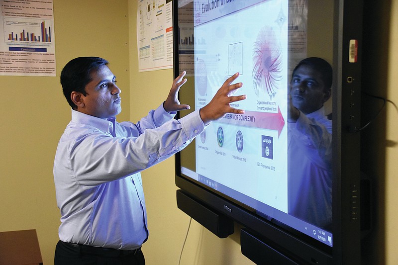 Nitin Agarwal, professor of information science at University of Arkansas at Little Rock, talks about the evolution of botnets Friday, Sept. 25, 2020 at the Engineering and Information Technology Building.
(Arkansas Democrat-Gazette/Staci Vandagriff)