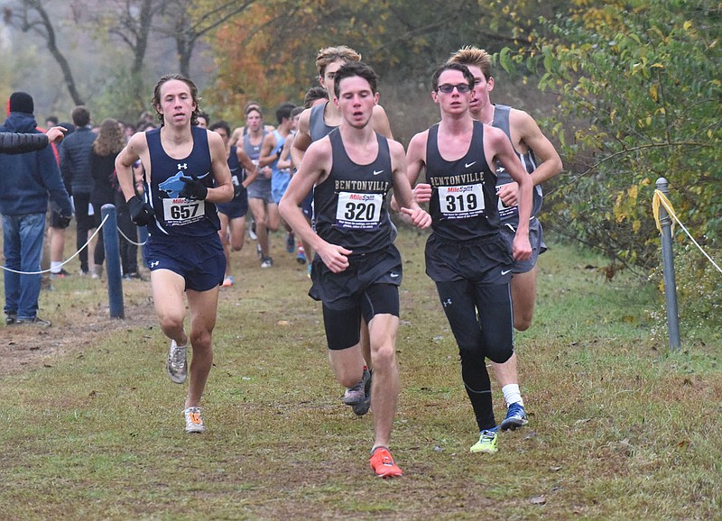 Dylan Mayberry (center), Bentonville High School, leads the pack of runners, including twin brother Dawson Mayberry (right), en route to winning the boys race on Oct. 27 2020. Go to nwaonline.com/201028Daily/ to see more photos.
(NWA Democrat-Gazette/Flip Putthoff)