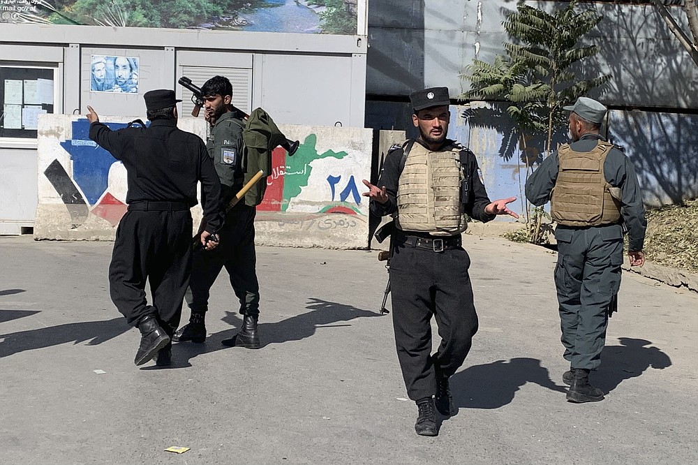 Afghan police arrive at the site of an attack at Kabul University in Kabul, Afghanistan, Monday, Nov. 2, 2020. Gunfire erupted at the university in the Afghan capital early Monday and police have surrounded the sprawling campus, authorities said. (AP Photo/Rahmat Gul)