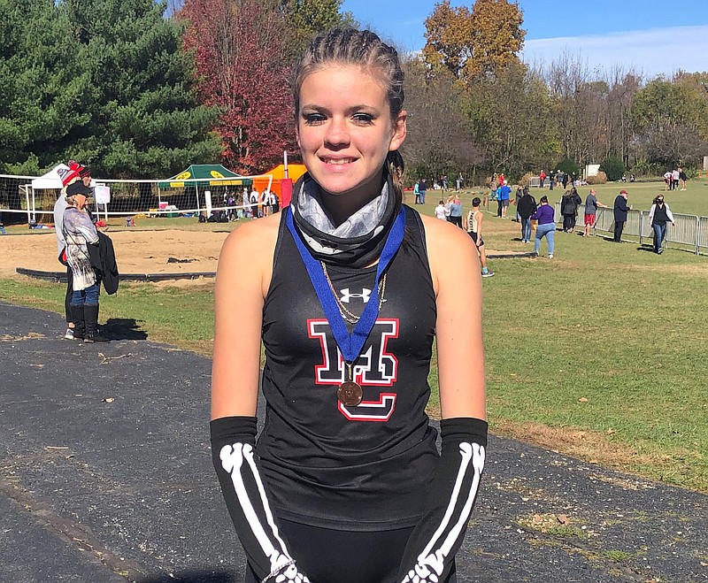Courtesy Photo Melysia McCrory is shown with her 12th place medal from the Missouri Class 4 District 6 Cross Country Championships held on Oct. 31 at Nixa High School. McCrory's 12th place finish earned her a trip to the state cross country championships set for Friday in Columbia.