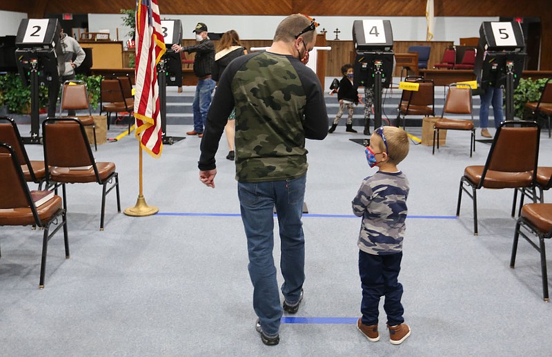 Shane Ruark, 5, waits with his father Stephen in line to vote Tuesday, November 3, 2020, at the voting center at First Church of the Nazarene in Springdale. Tuesday was the general election. Check out nwaonline.com/201104Daily/ and nwadg.com/photos for a photo gallery.(NWA Democrat-Gazette/David Gottschalk)