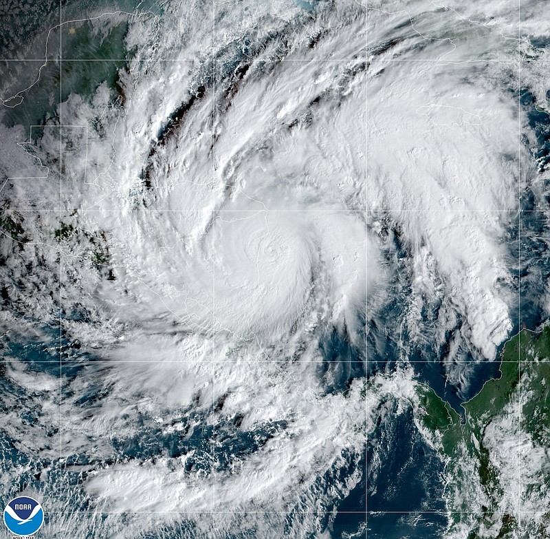 This GeoColor satellite image taken Tuesday, Nov. 3, 2020, and provided by NOAA, shows Hurricane Eta in the Caribbean Sea, arriving at Nicaragua's northern shore. Eta inched closer on Tuesday as a Category 4 storm. (NOAA via AP)
