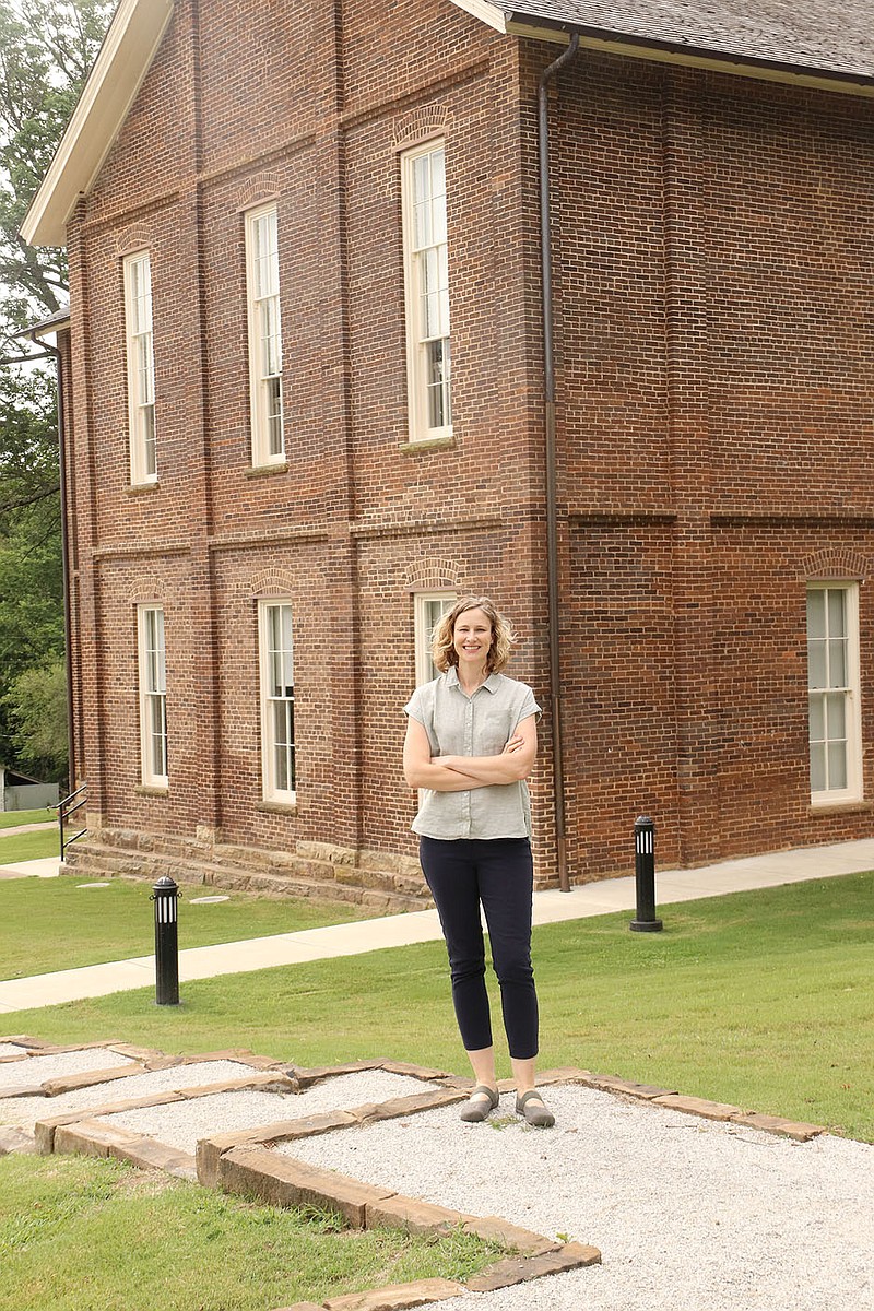 Vanessa McKuin, director of Historic Cane Hill Inc., stepped into her role in June during the covid-19 pandemic. “Vanessa’s biggest challenge is going to be how can you partner with other organizations in the area and in the state to make what we have accessible to people,” says John Greer, co-chairman of the Historic Cane Hill Executive Board. Here, she stands beside Historic Cane Hill College, listed on the National Register of Historic Places. The current two-story, brick college building was constructed in 1886 but had fallen in disrepair. Historic Cane Hill Inc. completely renovated the building during a three-phase restoration project.

(NWA Democrat-Gazette/Lynn Kutter)