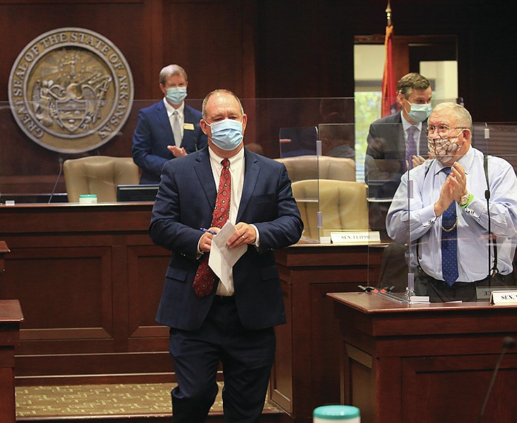 Sen. Jimmy Hickey Jr., R-Texarkana, makes his way to the podium Friday Nov. 6, 2020 in Little Rock after being elected as the next Senate President Pro Tempore during an organizational meeting of the Arkansas Senate. 
(Arkansas Democrat-Gazette/Staton Breidenthal)