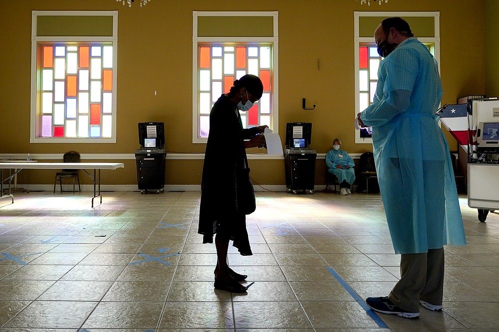A woman waits to vote at the Cathedral of Praise church on Election Day Tuesday, Nov. 3, 2020, in Nashville, Tenn. (AP Photo/Mark Humphrey)