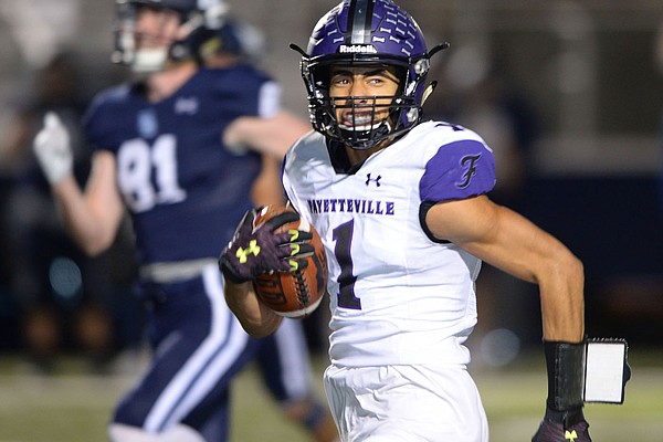 Fayetteville kick returner Isaiah Sategna (1) returns the opening kickoff for a touchdown Friday, Nov. 6, 2020, during the first half of play against Springdale Har-Ber at Wildcat Stadium in Springdale. Visit nwaonline.com/201107Daily/ for today's photo gallery.
(NWA Democrat-Gazette/Andy Shupe)