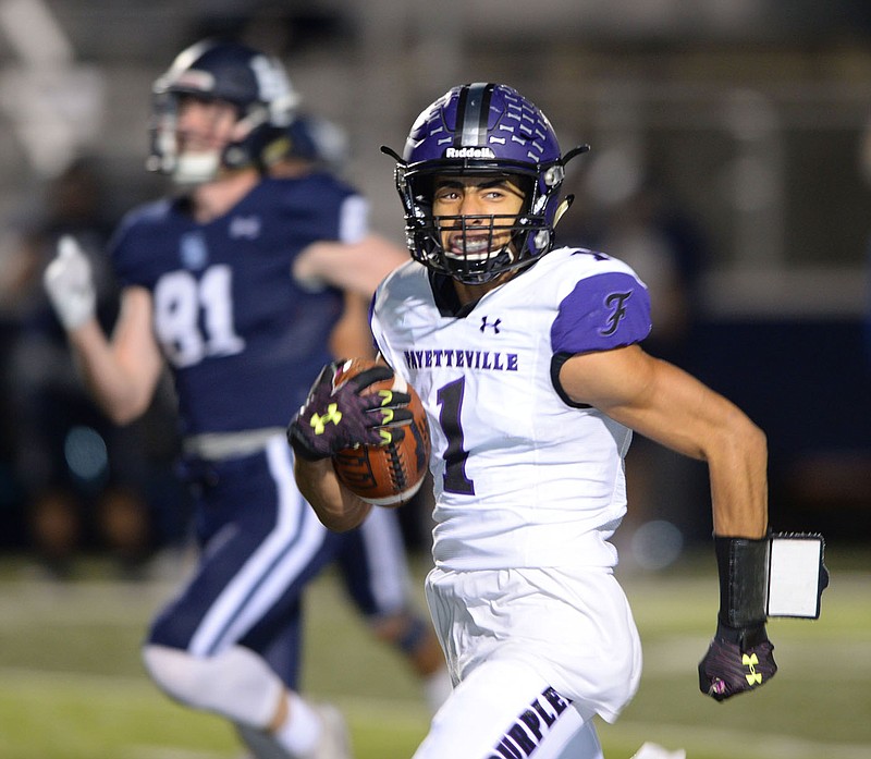 Fayetteville kick returner Isaiah Sategna (1) returns the opening kickoff for a touchdown Friday, Nov. 6, 2020, during the first half of play against Springdale Har-Ber at Wildcat Stadium in Springdale. Visit nwaonline.com/201107Daily/ for today's photo gallery. 
(NWA Democrat-Gazette/Andy Shupe)