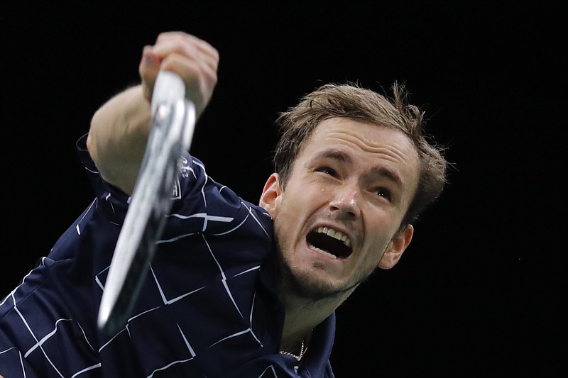 Russia's Daniil Medvedev smashes the ball to Germany's Alexander Zverev during the Paris Masters tennis tournament final, Sunday, Nov. 8, 2020 in Paris. (AP Photo/Christophe Ena)