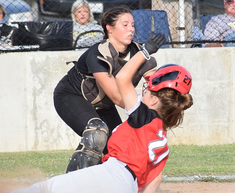 RICK PECK/SPECIAL TO MCDONALD COUNTY PRESS McDonald County's Neveah Dodson tries to slide past a catcher during the Lady Mustangs' 21-4 season. She was recently named to the Missouri Class 4 All-State first team.