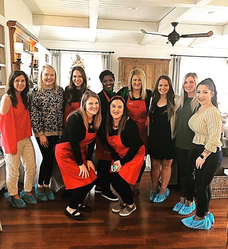 Junior League of Fort Smith volunteers welcome guests to a previous Holiday Home Tour. The group has set two fundraisers for the coming weeks. Miles for a Mission virtual race will be run Nov. 15-30 and the Virtual Holiday Home Tour 2020 will be Dec. 6.