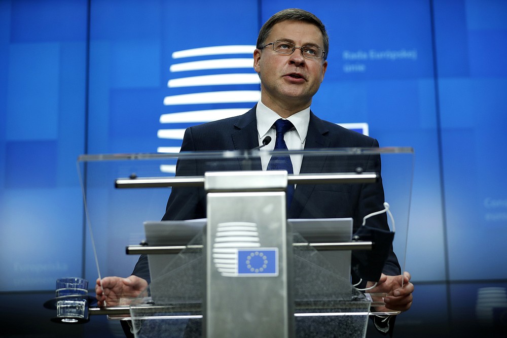 European Commission Vice-President Valdis Dombrovskis addresses a media conference after a meeting of EU trade ministers, in videoconference format, at the European Council building in Brussels, Monday, Nov. 9, 2020. European Union trade ministers on Monday exchanged views on the trade policy review and relations with China and the United States. (AP Photo/Francisco Seco, Pool)