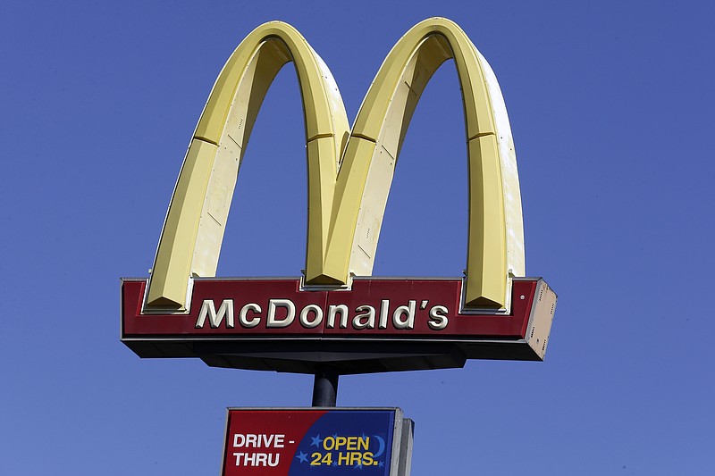 FILE - This Oct. 17, 2019 file photo shows a McDonald's sign along Interstate 40/85 in Burlington, N.C. McDonald’s sales improved throughout the second quarter, Tuesday, July 28, 2020,  as markets reopened globally, but the fast food giant still faces a bumpy recovery. (AP Photo/Gerry Broome, File)
