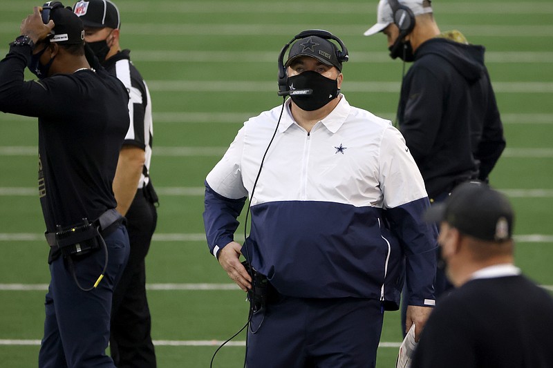 Dallas Cowboys head coach Mike McCarthy, center, watches play against the Pittsburgh Steelers in the first half of an NFL football game in Arlington, Texas, Sunday, Nov. 8, 2020. (AP Photo/Ron Jenkins)