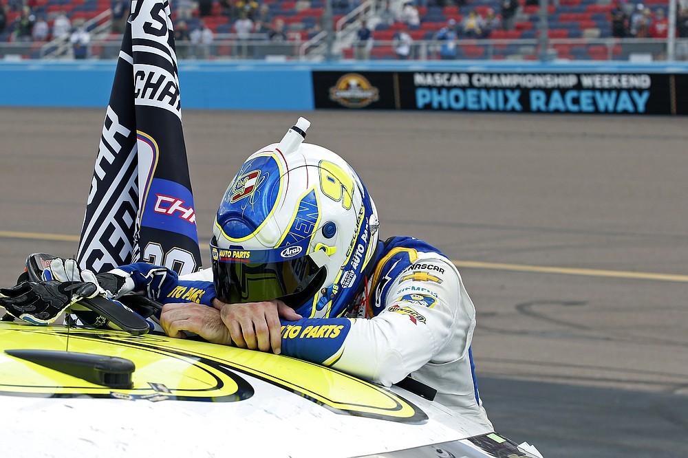 Chase Elliott reacts following his season championship victory in a NASCAR Cup Series auto race at Phoenix Raceway, Sunday, Nov. 8, 2020, in Avondale, Ariz. (AP Photo/Ralph Freso)