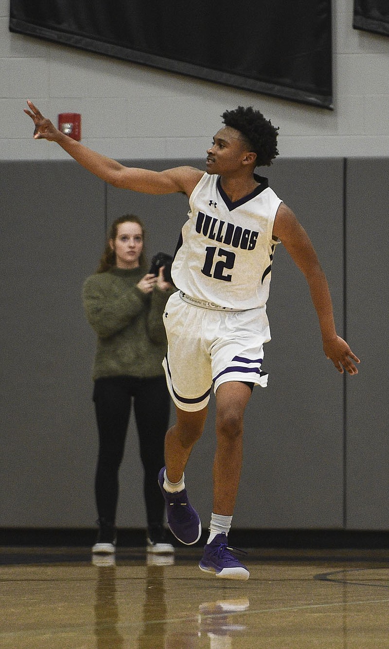 Fayetteville guard Corey Williams, Jr (12) reacts after a score during a basketball game, Friday, January 10, 2020 at Fayetteville. Williams will lead the Purple'Dogs into the 2020-21 season as one of the top guards in the 6A-West Conference. 
(NWA Democrat-Gazette/Charlie Kaijo)