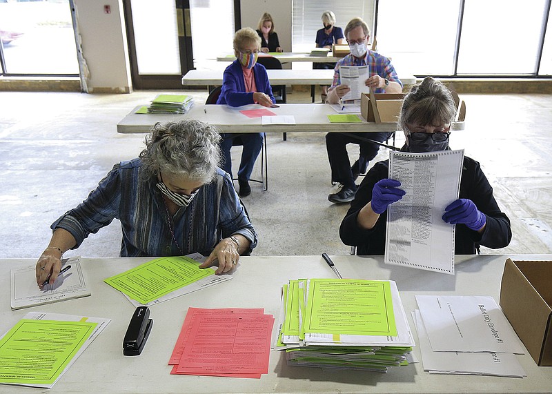 Election officials work Tuesday Nov. 10, 2020 in Little Rock at the Pulaski County Election Commission to tabulate provisional ballots cast during the Nov. 3, 2020, General Election. (Arkansas Democrat-Gazette/Staton Breidenthal)