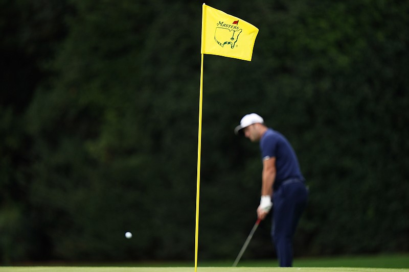 Jon Rahm, of Spain, chips to the 15th green during a practice round for the Masters golf tournament Tuesday, Nov. 10, 2020, in Augusta, Ga. (AP Photo/Matt Slocum)