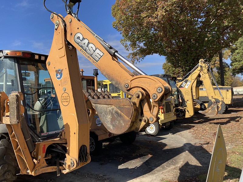 Heavy equipment sits at the ready at the Pine Bluff Street Department yard on Wednesday, Nov. 11, which was Veterans Day, a national holiday during which city employees were given the day off, along with many county, state, and federal employees. (Pine Bluff Commercial/Byron Tate)