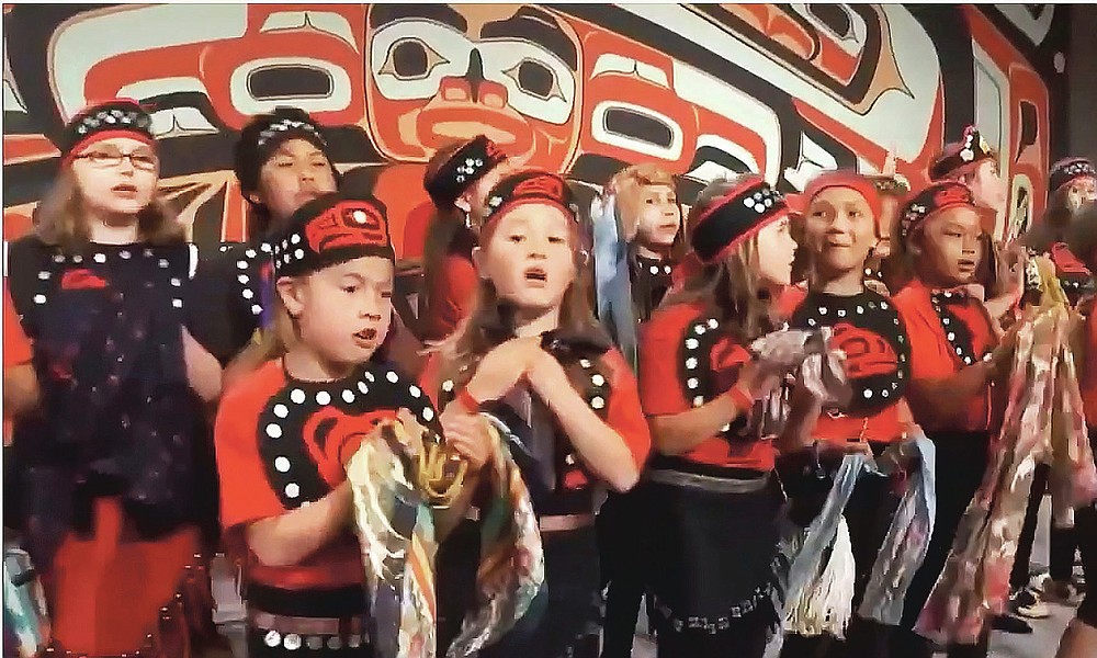Provided by the Sealaska Heritage Institute, this photo from a Nov. 5, 2020, Zoom memorial service for Tlingit elder David Katzeek, in Juneau, Alaska, shows a 2018 recording of children performing a song written by Katzeek as people honored Katzeek over the internet as the pandemic had made in-person ceremonies impossible. (Sealaska Heritage Institute via AP)