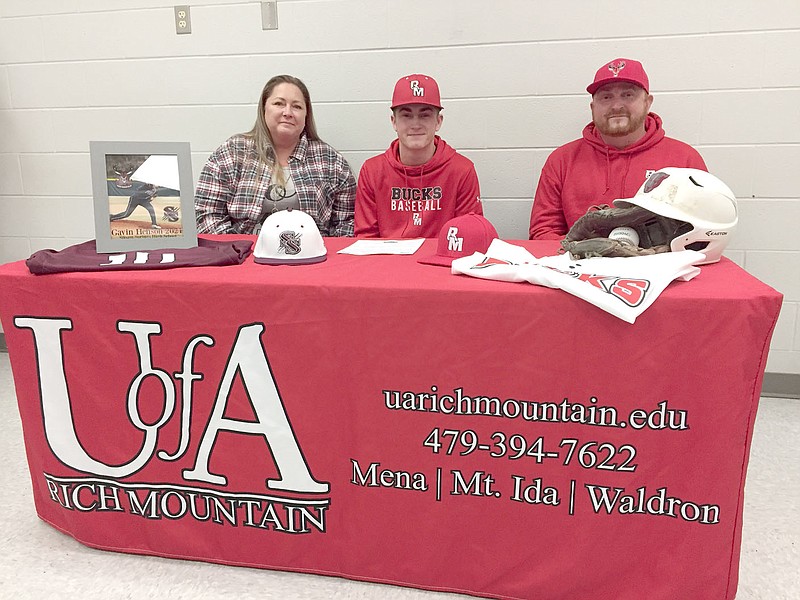 Graham Thomas/Herald-Leader
Siloam Springs senior Gavin Henson, center, signed a letter of intent last Thursday to play baseball at the University of Arkansas-Rich Mountain. Also pictured are Henson's parents, Deni Henson, left, and Mike Henson, right.