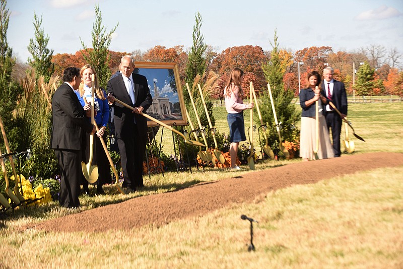 Elder David Harris (third from left) and his wife, Lisa, gather with others on Saturday Nov. 7 2020 for the temple groundbreaking.
(NWA Democrat-Gazette/Flip Putthoff)