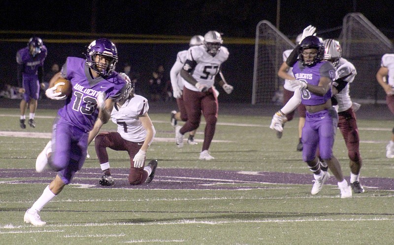 Matt Hutcheson/Special to Siloam Sunday
El Dorado wide receiver R.J. Thomas runs for a big gain against Siloam Springs on Friday in the opening round of the Class 6A playoffs.