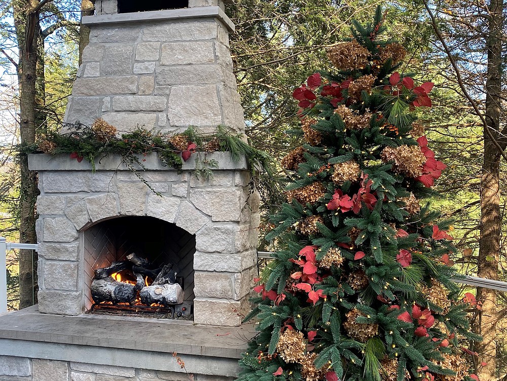 Outdoor decor ― This artificial tree, which has UV protection and lights certified for outdoor use, helps designer Evette Rios set the stage for her small holiday gatherings outside. (Courtesy of Evette Rios)