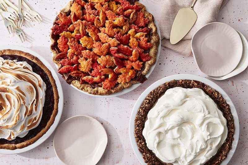 From left: Roasted Cranberry with Meringue topping in Press in Cookie Crust; Apple Pie With an All-Butter Crust and Painted Cutout Topping; Fall-Spice Pudding Pie With Whipped Cream and a Nut Crust.(Mark Weinberg for The Washington Post)