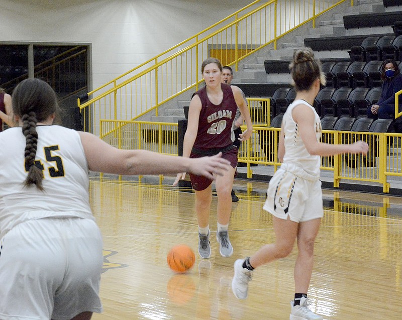 Graham Thomas/Herald-Leader
Siloam Springs sophomore Brooke Smith brings the ball up the floor Monday against Prairie Grove. The Lady Panthers picked up their season win of the season 47-35.