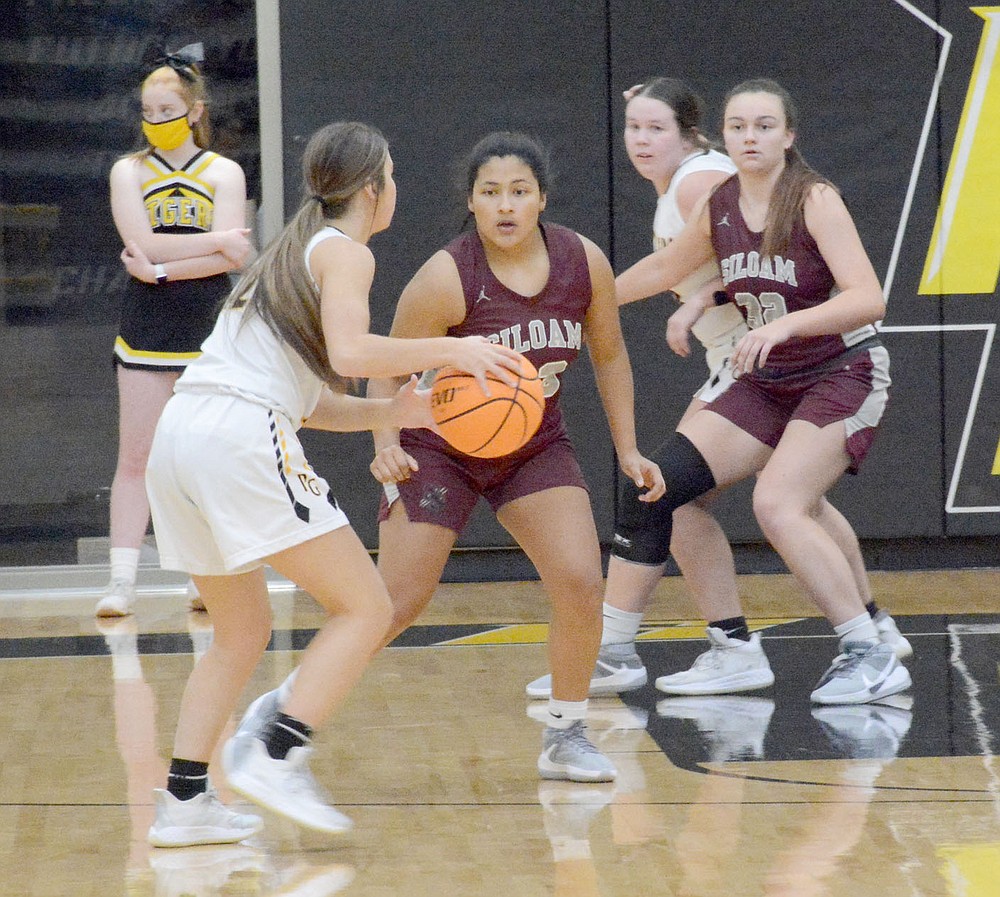 Graham Thomas/Herald-Leader
Siloam Springs junior Halle Hernandez defends Prairie Grove's Torie Price during Monday's game at Prairie Grove.