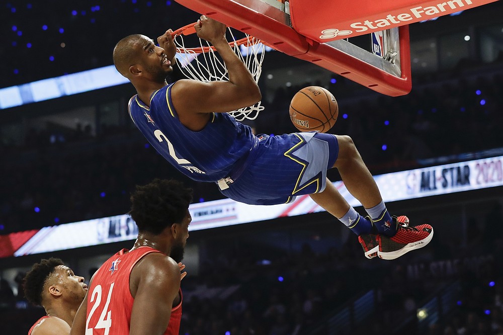 FILE - Chris Paul of the Oklahoma City Thunder dunks during the first half of the NBA All-Star basketball game in Chicago, in this Feb. 16, 2020, file photo. A person with knowledge of the situation says All-Star guard Chris Paul is being traded from the Oklahoma City Thunder to the Phoenix Suns, where he'll play alongside one of the league's most dynamic young scorers in fellow All-Star Devin Booker. The Thunder are acquiring Ricky Rubio, Kelly Oubre, Jalen Lecque, Ty Jerome and a first-round pick that will be conveyed sometime between 2022 and 2025, said the person who spoke to The Associated Press on condition of anonymity because the trade had not been finalized by the league. (AP Photo/Nam Huh, File)