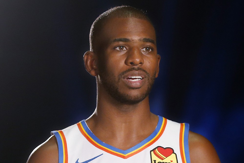 FILE - Oklahoma City Thunder guard Chris Paul (3) is interviewed during an NBA basketball media day in Oklahoma City, in this Monday, Sept. 30, 2019, file photo. A person with knowledge of the situation says All-Star guard Chris Paul is being traded from the Oklahoma City Thunder to the Phoenix Suns, where he'll play alongside one of the league's most dynamic young scorers in fellow All-Star Devin Booker. The Thunder are acquiring Ricky Rubio, Kelly Oubre, Jalen Lecque, Ty Jerome and a first-round pick that will be conveyed sometime between 2022 and 2025, said the person who spoke to The Associated Press on condition of anonymity because the trade had not been finalized by the league. (AP Photo/Sue Ogrocki, File)
