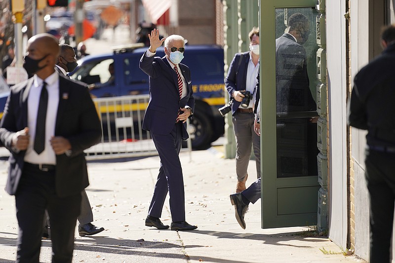 President-elect Joe Biden arrives to attend a briefing on the economy at The Queen theater, Monday, Nov. 16, 2020, in Wilmington, Del. (AP Photo/Andrew Harnik)