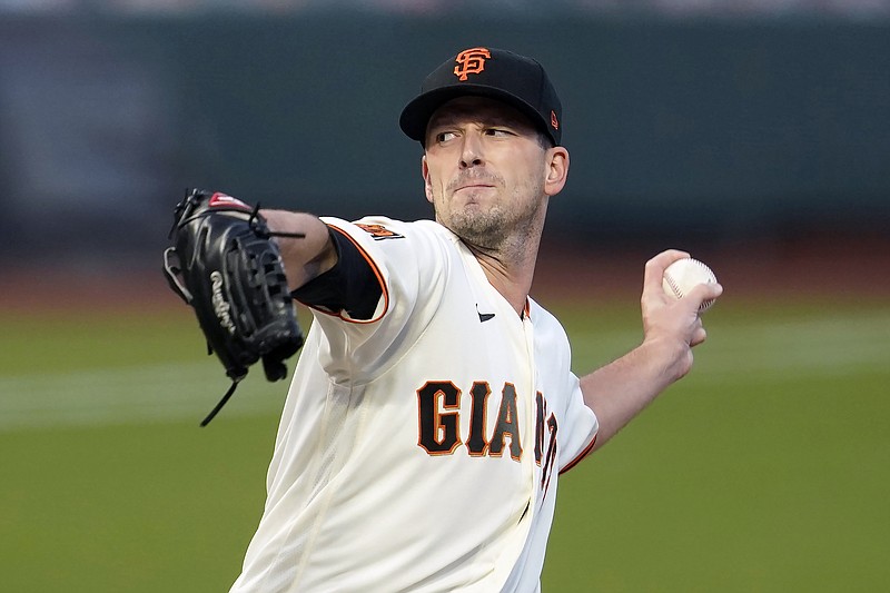 San Francisco Giants' Drew Smyly throws against the Seattle Mariners during a baseball game in San Francisco, Wednesday, Sept. 16, 2020. Smyly became the first of the 181 free agents to switch teams when he agreed Monday, Nov. 16, 2020, to an $11 million, one-year contract with the Atlanta Braves, who are looking to bolster a rotation that was depleted by injuries and disappointing performances. (AP Photo/Jeff Chiu)