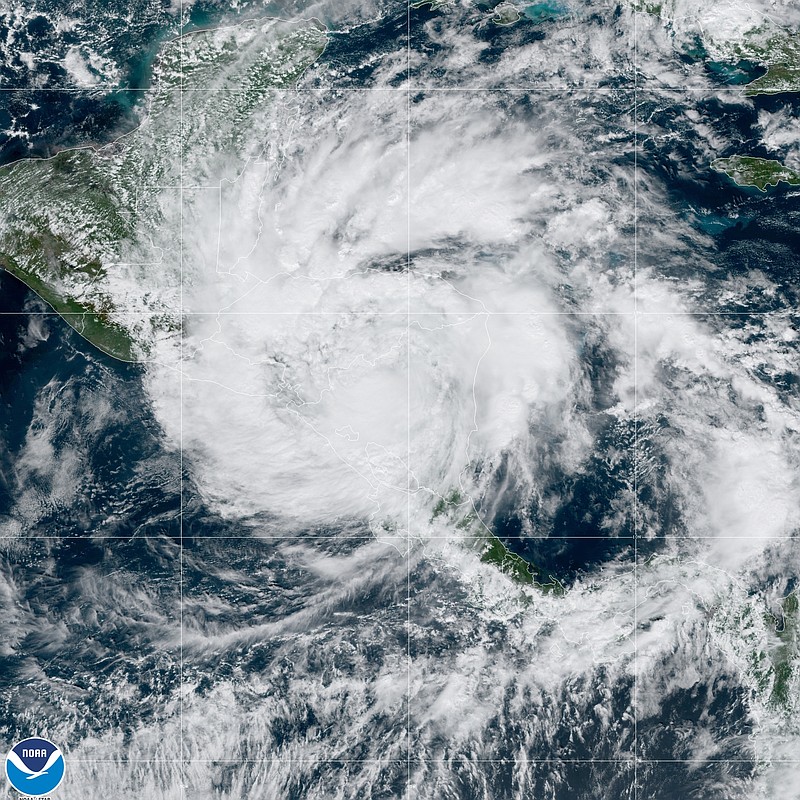 This satellite image made available by NOAA shows Hurricane Iota over Nicaragua and Honduras on Tuesday, Nov. 17, 2020, at 12:20 ET. Hurricane Iota tore across Nicaragua on Tuesday, hours after roaring ashore as a Category 4 storm along almost exactly the same stretch of the Caribbean coast that was recently devastated by an equally powerful hurricane. (NOAA via AP)